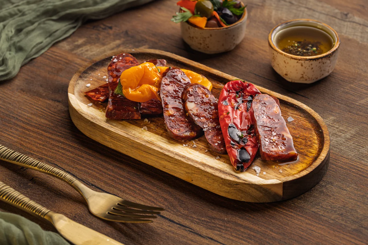 Chorizo with grilled peppers and olives
