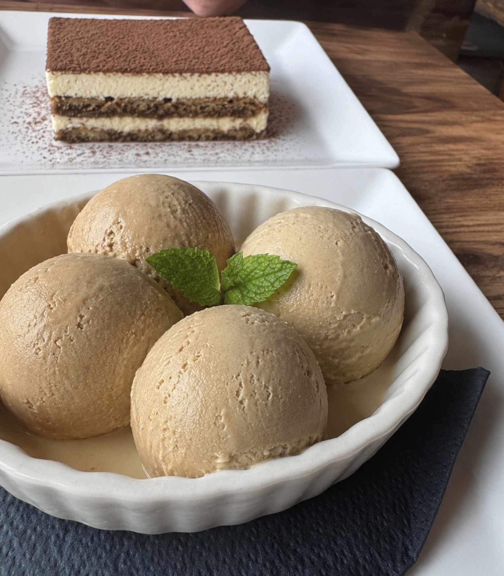 Tiramisu and a bowl of caramel gelato scoops