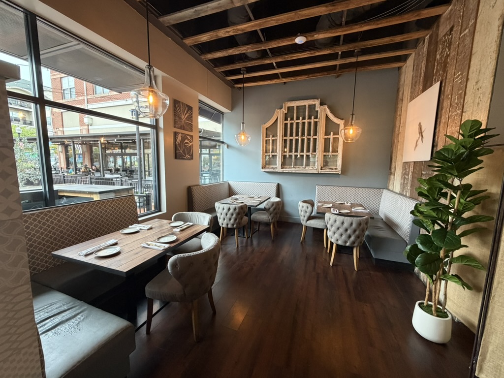An intimate dining area at Falcon & Fig prepared for guests