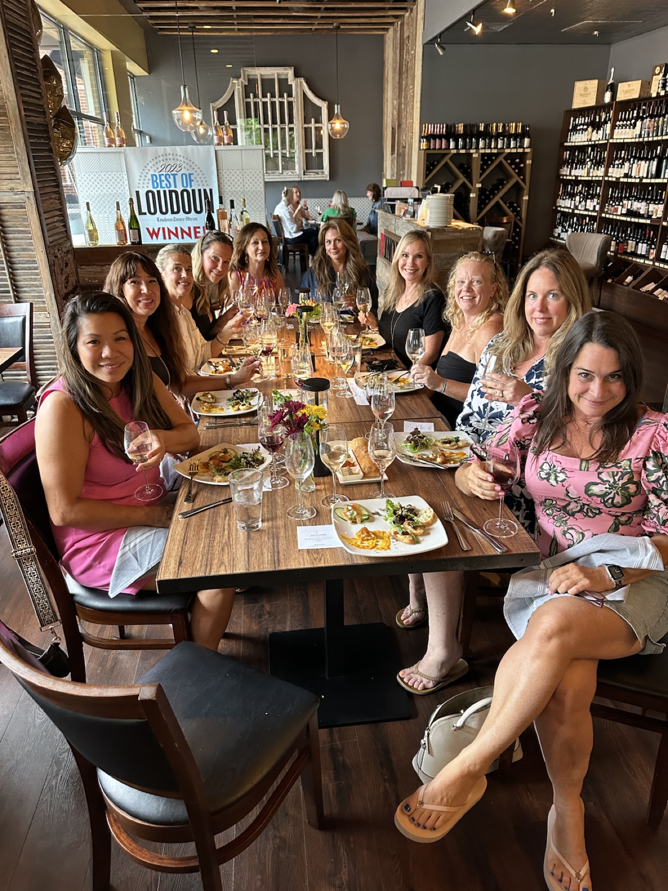 Guests gathering around a Falcon & Fig table in Leesburg